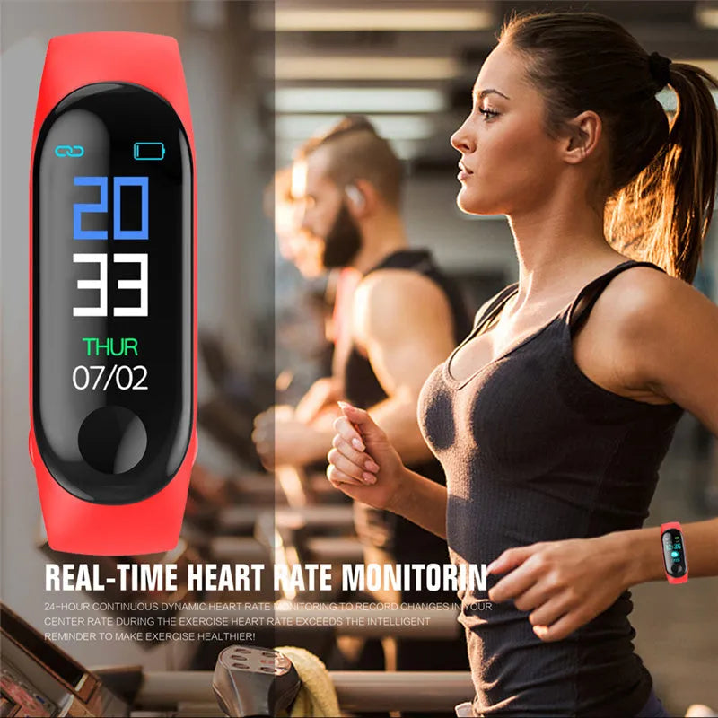 M3 smart bracelet with colour screen showing fitness stats, on a wrist with a black TPE strap.