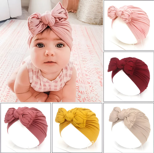 Soft knitted acrylic baby girl turban hat in various colours fitting 0-28 months