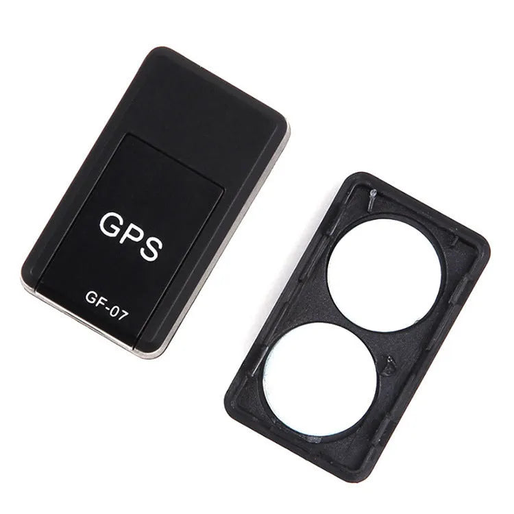 Small black magnetic GPS tracker device with USB cable for real-time vehicle and asset location tracking.