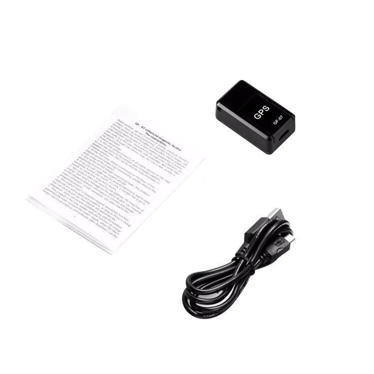 Small black magnetic GPS tracker device with USB cable for real-time vehicle and asset location tracking.