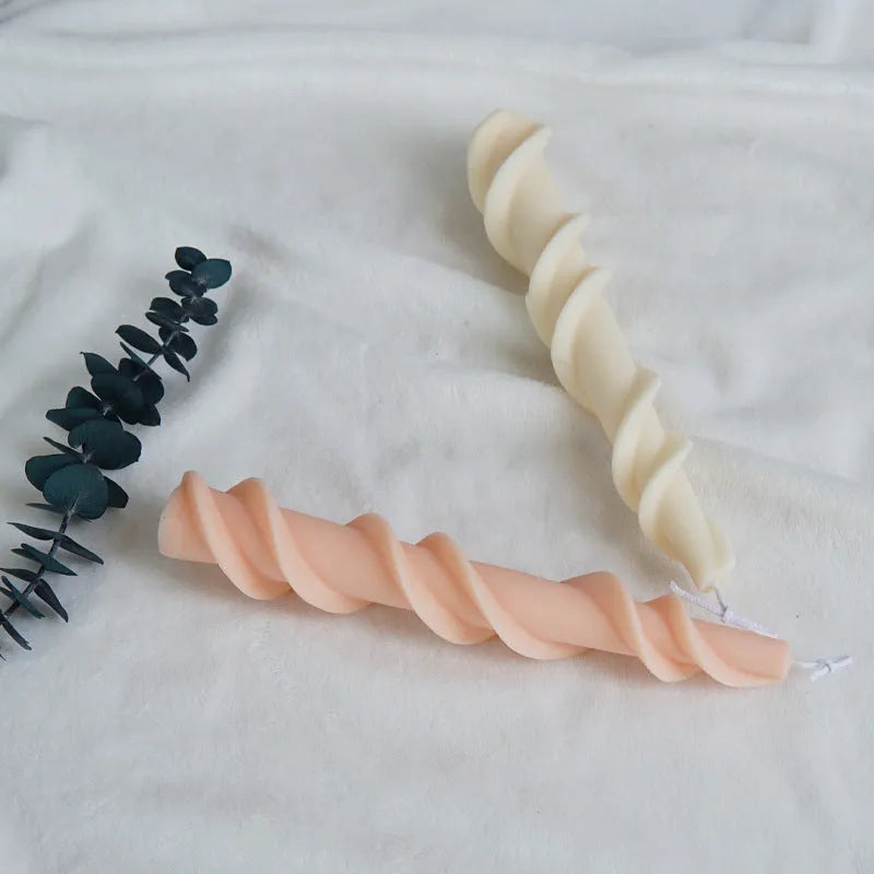 Handmade spiral lace rod silicone candle mould for creating textured decorative candles.