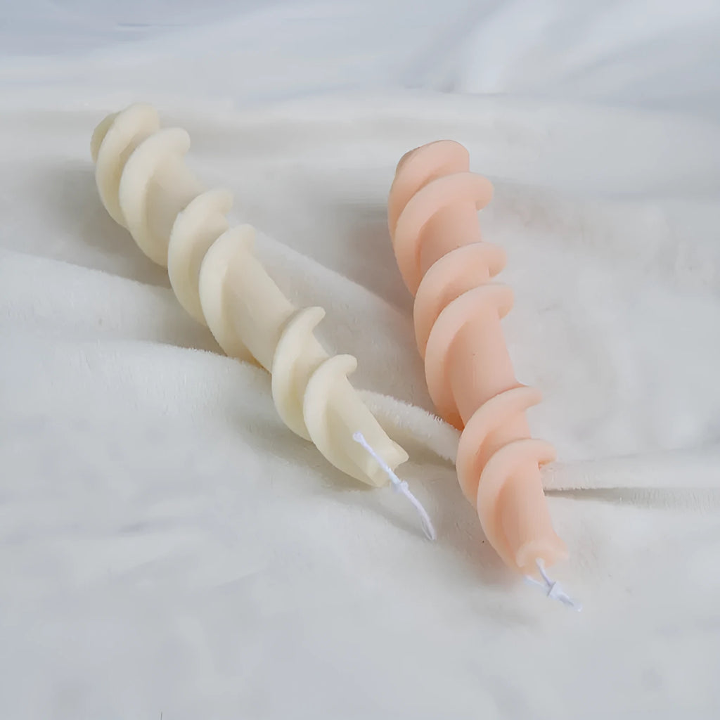 Handmade spiral lace rod silicone candle mould for creating textured decorative candles.