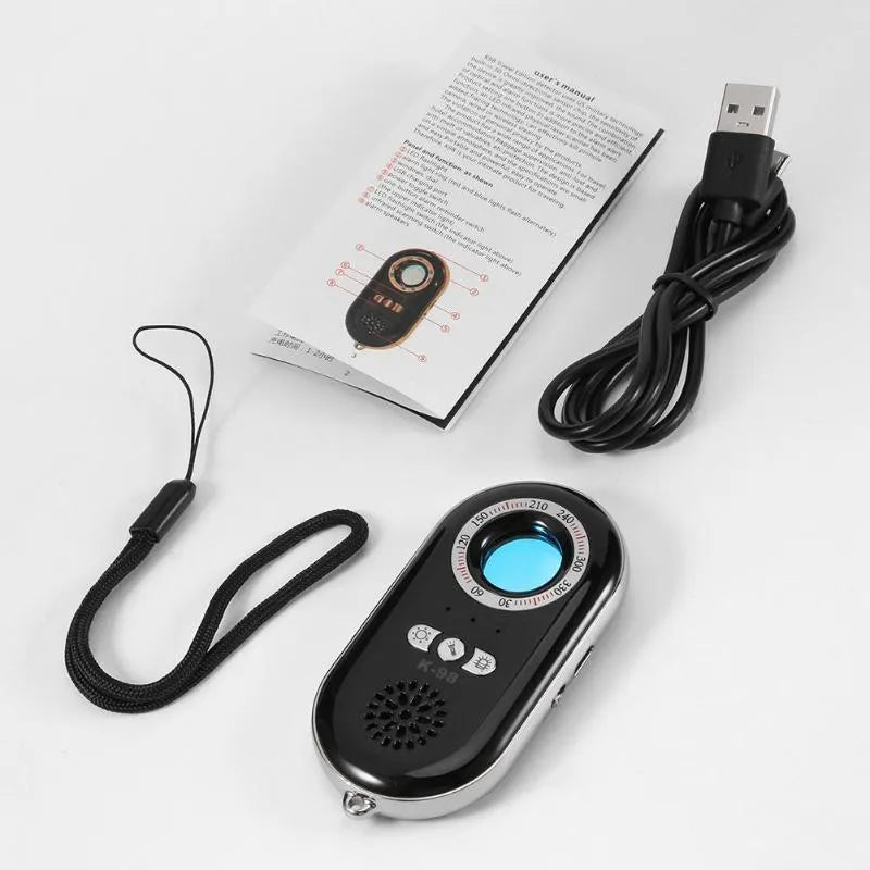 Compact black wireless signal detector with vibration alarm for anti-theft security.