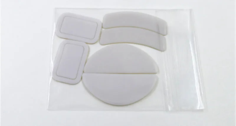 White Razer Juggern arc edge mouse skate replacements for Logitech GPX Superlight and GPW 2 mice with anti-static tweezers.