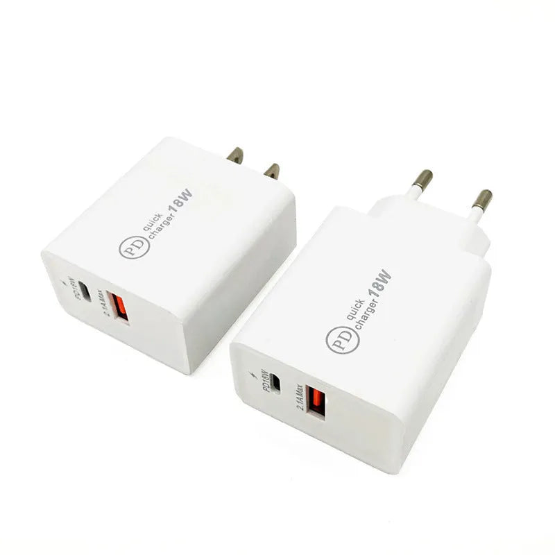 Compact white 18W USB-C fast wall charger with UK plug on a wooden table