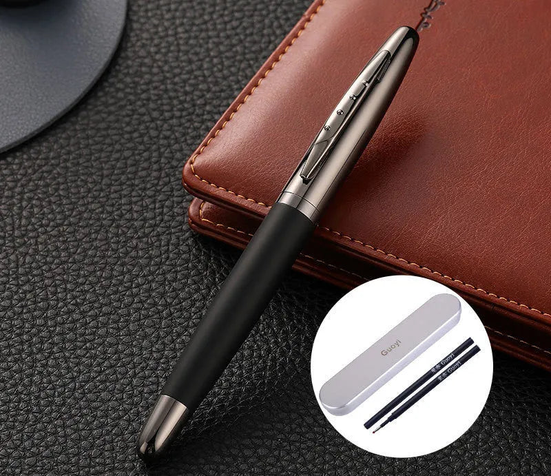 Heavy metal signature pen with non-slip grip and blue ink refill on a desk surface
