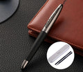 Heavy metal signature pen with non-slip grip and blue ink refill on a desk surface