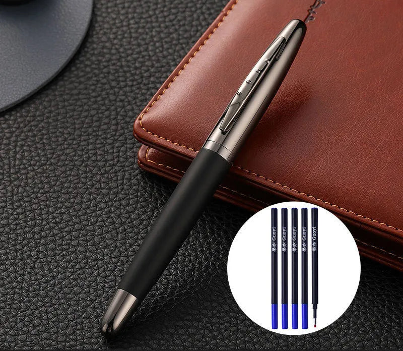 Heavy metal signature pen with non-slip grip and blue ink refill on a desk surface