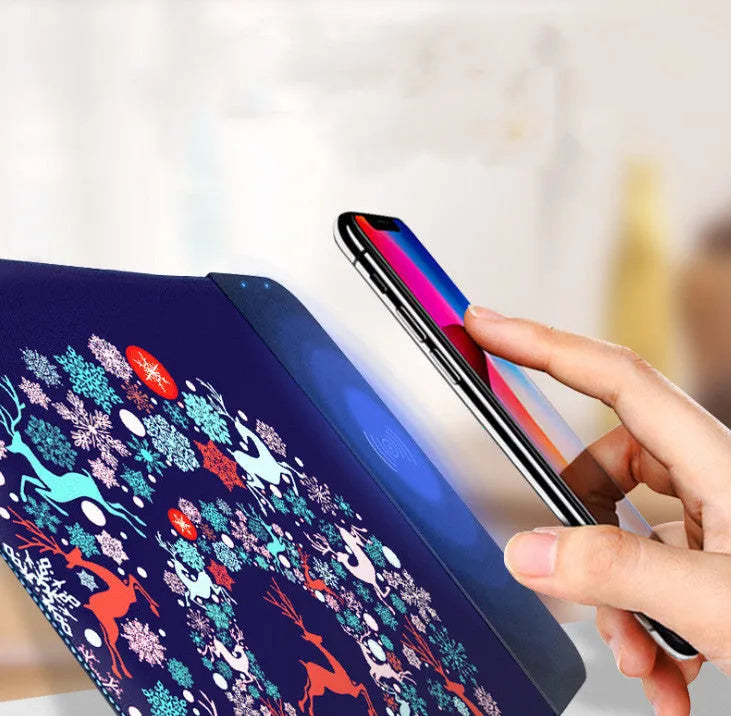 Cartoon-style wireless charging mouse pad with glowing RGB lights on a desk