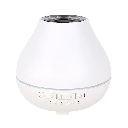 Round white Bluetooth humidifier and essential oil diffuser with night light on a wooden surface.