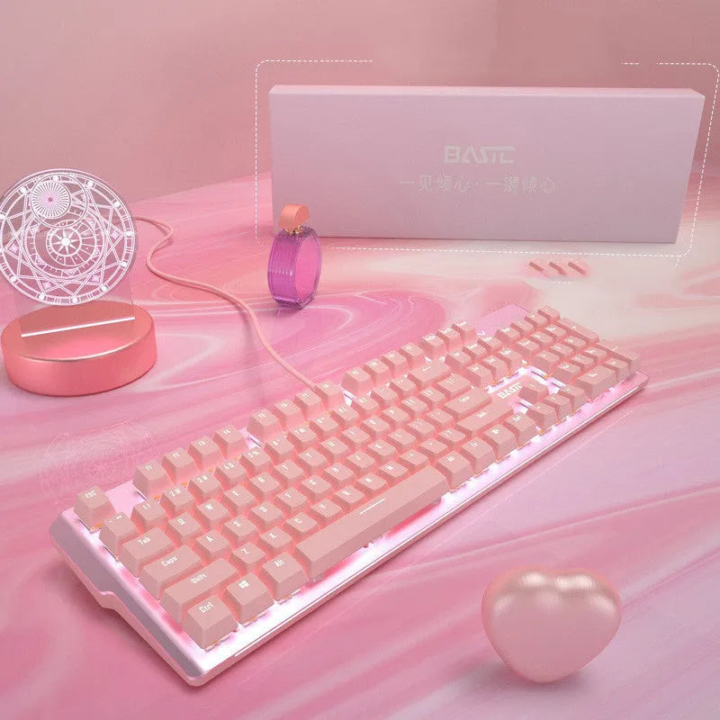 Pink coloured mechanical gaming keyboard and wired mouse set on a desk.