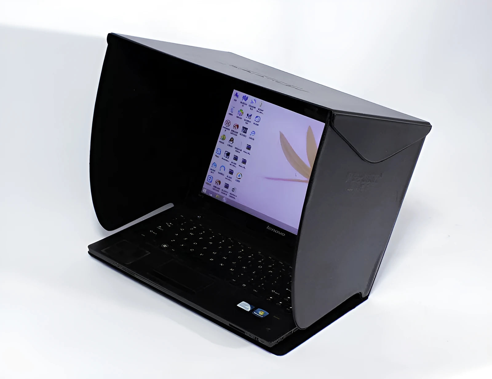 Black laptop sun hood folded flat showing PU outer and light-absorbing velvet inner lining