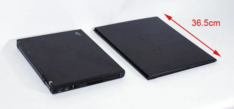 Black laptop sun hood folded flat showing PU outer and light-absorbing velvet inner lining
