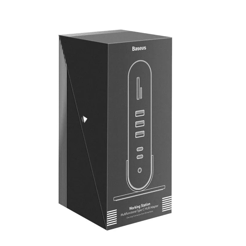 Deep space grey 16-in-1 multi-function USB-C docking station with external power supply on a desk.