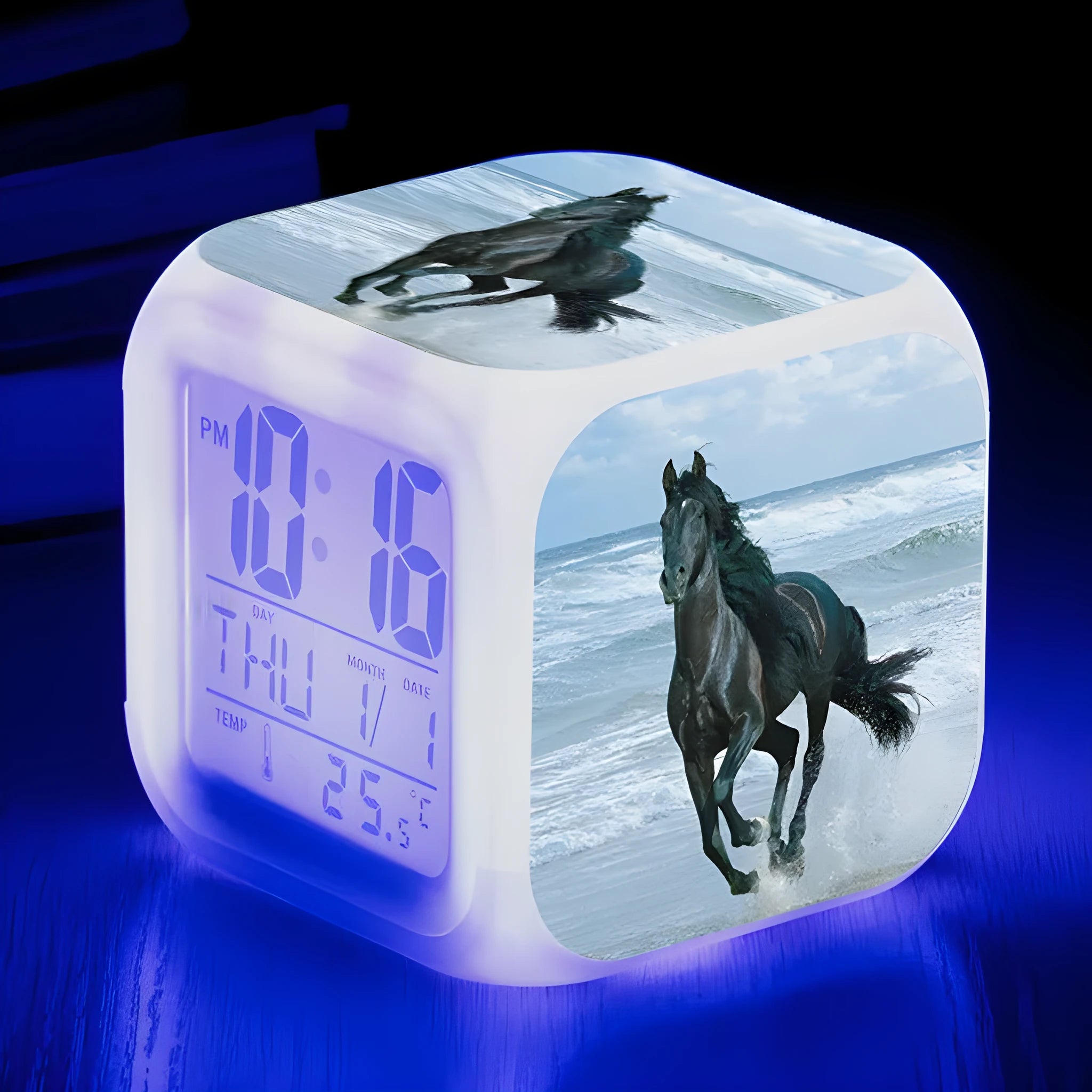 Square cartoon-style LED alarm clock showing digital time display with colour-changing illumination