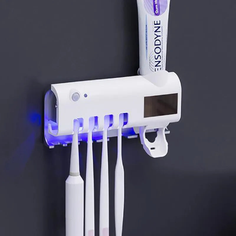 Smart UV toothbrush steriliser with automatic toothpaste squeezer in wall-mounted white design