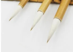 Three pure wool hair Chinese writing brushes with bamboo shafts in large, medium and small sizes