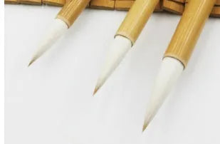 Three pure wool hair Chinese writing brushes with bamboo shafts in large, medium and small sizes