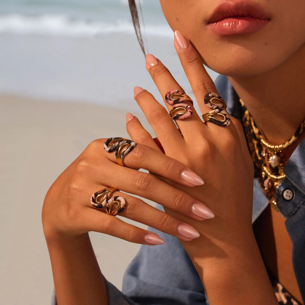 Geometric open mouth ring with leopard print design in electroplated stainless steel showing adjustable free-size construction