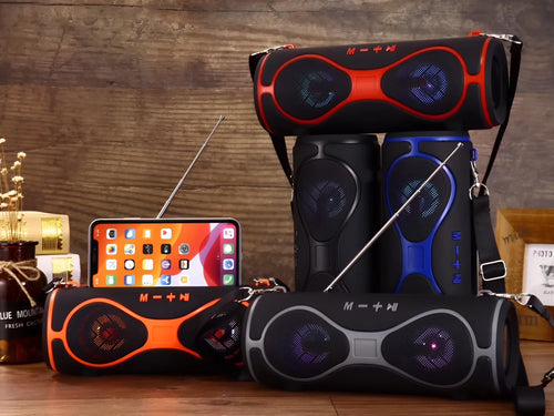 Multifunctional lantern Bluetooth speaker with shoulder strap and phone stand in black, blue, orange, red, or silver grey.