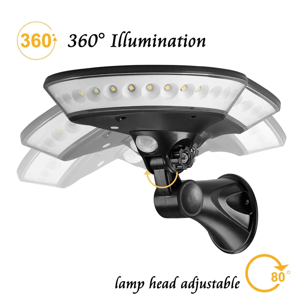 White 360-degree solar-powered outdoor light with motion sensor, shown in a garden setting.