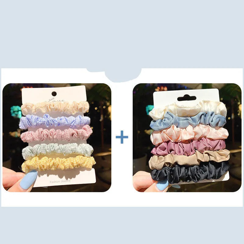 Set of 20 children's hair accessories including small intestine rings and large intestine ropes in assorted colours.