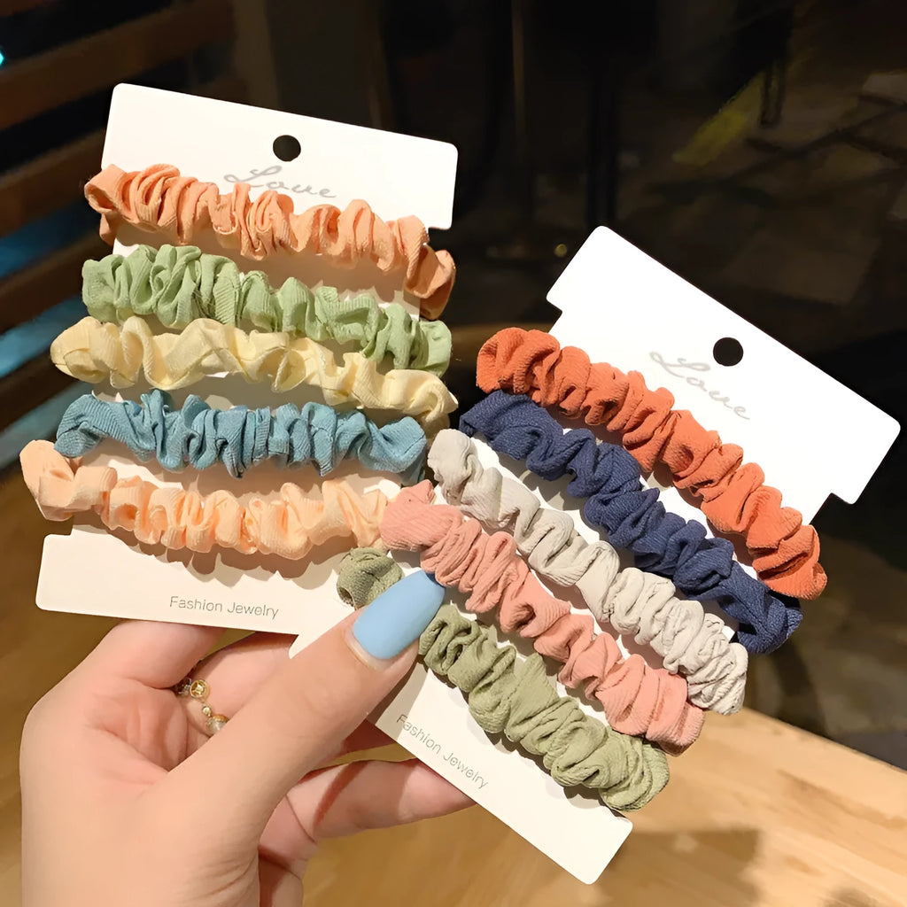 Set of 20 children's hair accessories including small intestine rings and large intestine ropes in assorted colours.