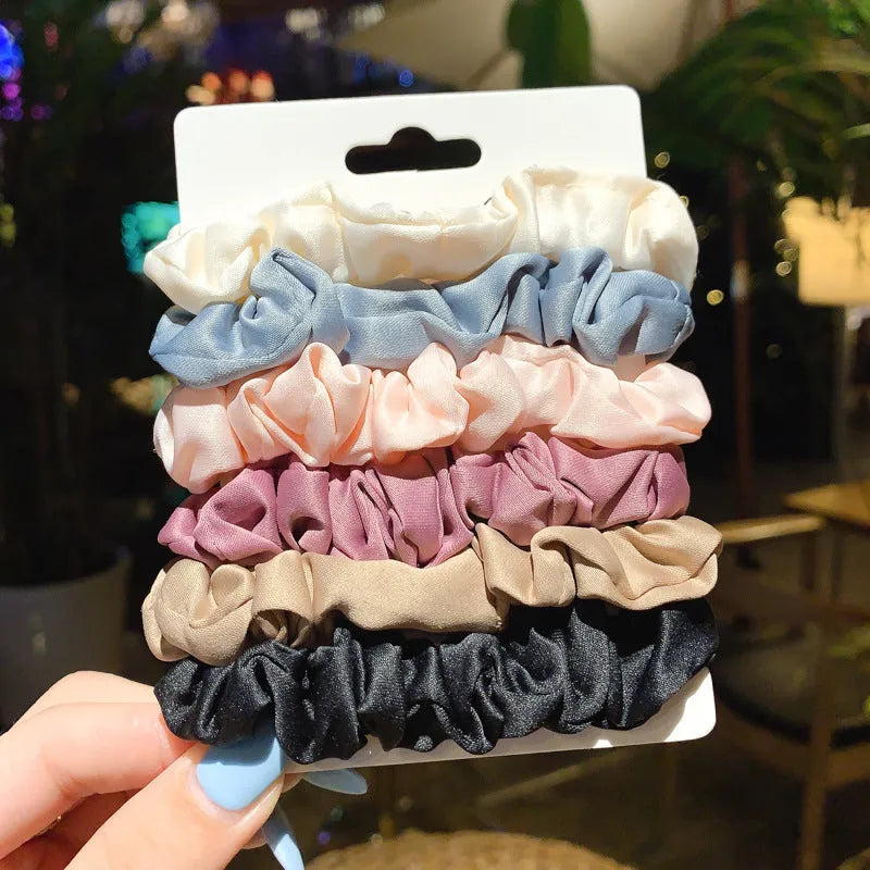 Set of 20 children's hair accessories including small intestine rings and large intestine ropes in assorted colours.