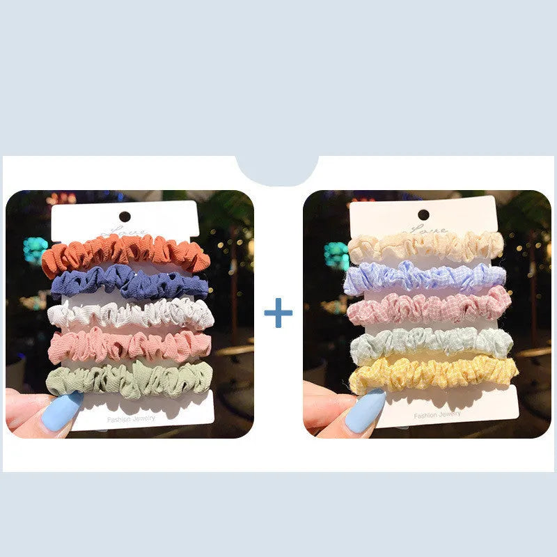 Set of 20 children's hair accessories including small intestine rings and large intestine ropes in assorted colours.