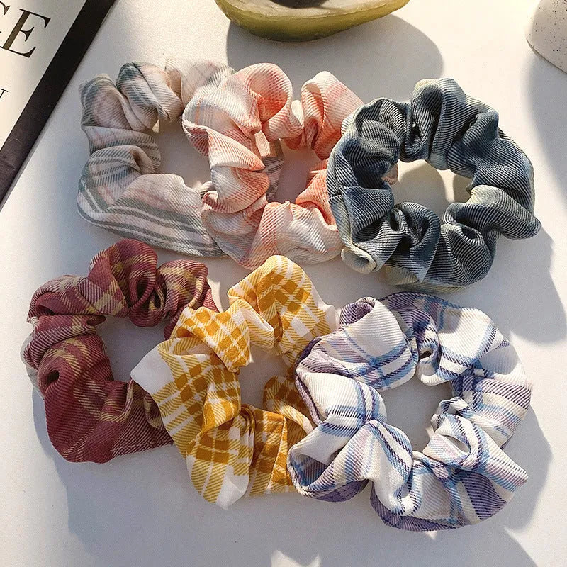 Set of 20 children's hair accessories including small intestine rings and large intestine ropes in assorted colours.