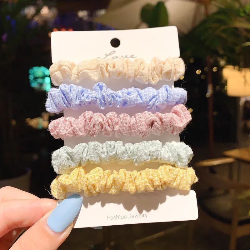Set of 20 children's hair accessories including small intestine rings and large intestine ropes in assorted colours.