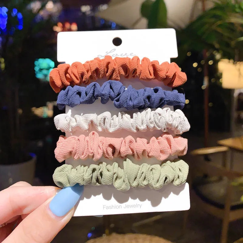 Set of 20 children's hair accessories including small intestine rings and large intestine ropes in assorted colours.