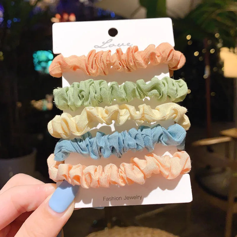 Set of 20 children's hair accessories including small intestine rings and large intestine ropes in assorted colours.
