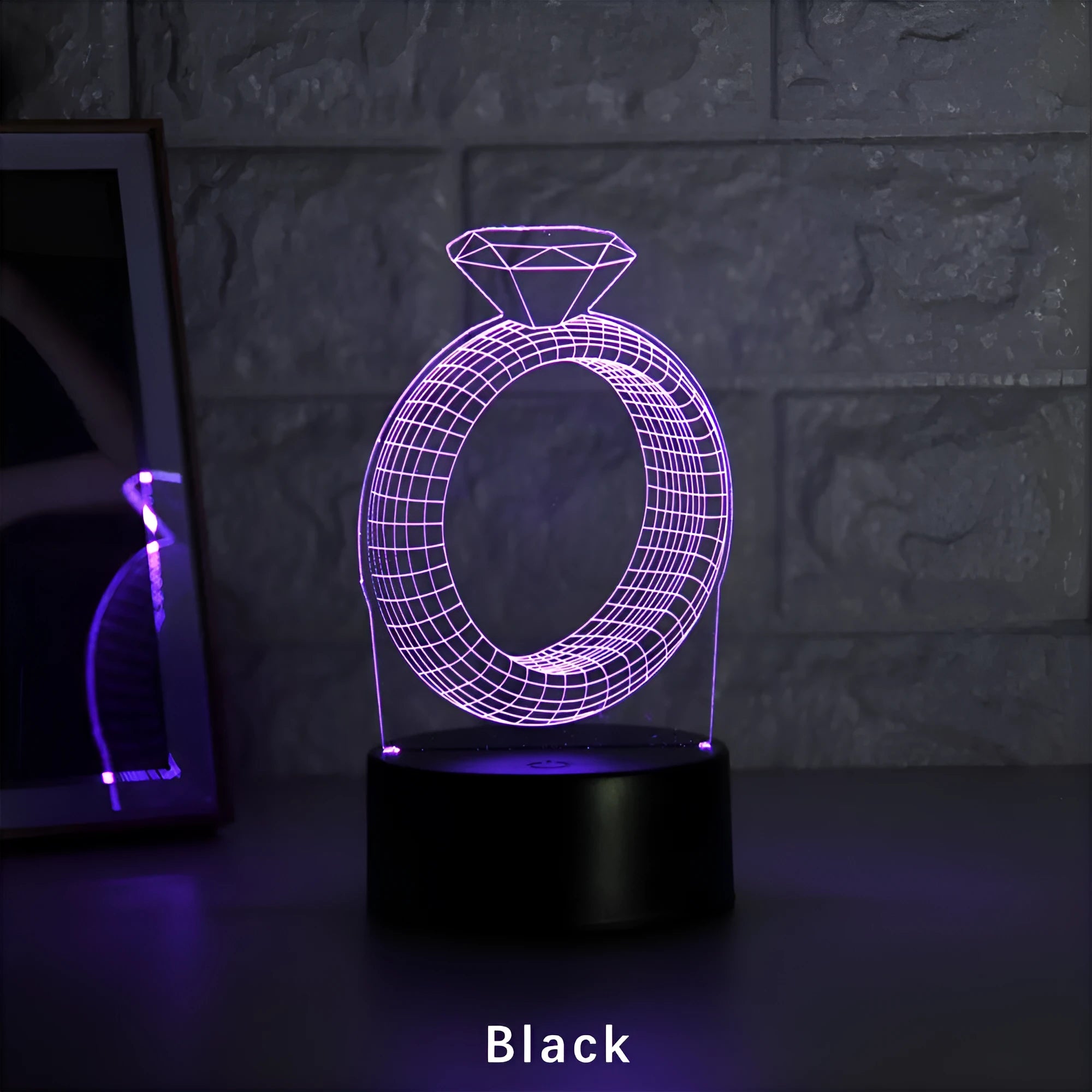 3D LED night light showing a glowing, laser-engraved diamond ring design on a black background.