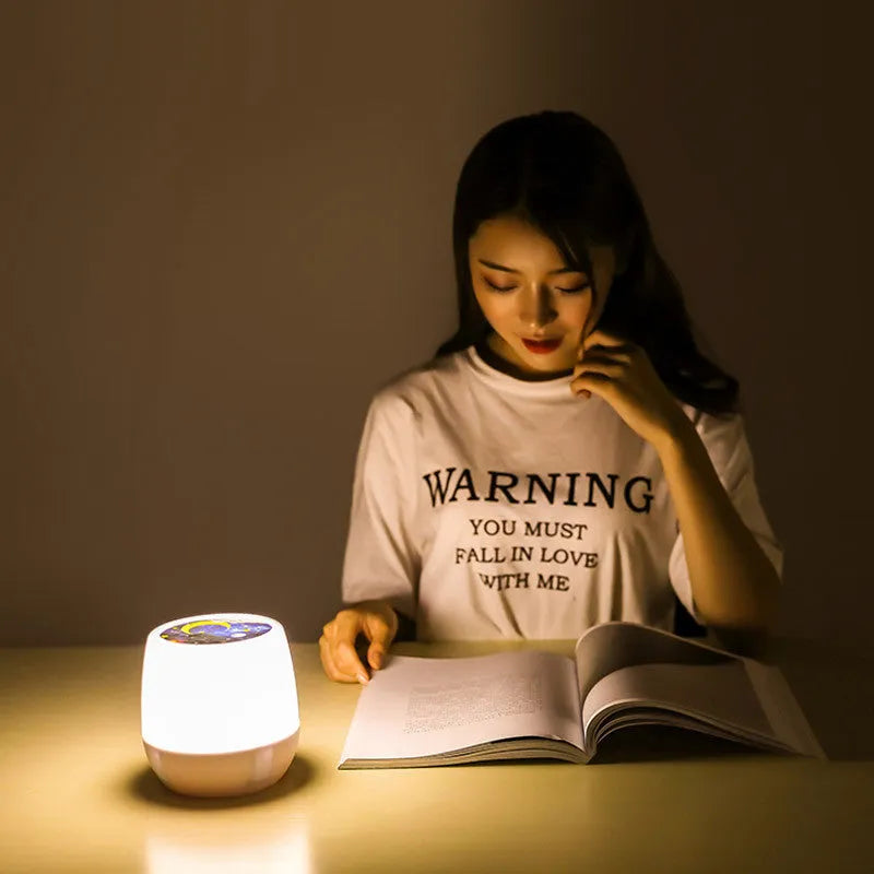 Pruixin rotating projector night light displaying star patterns on a bedroom ceiling.