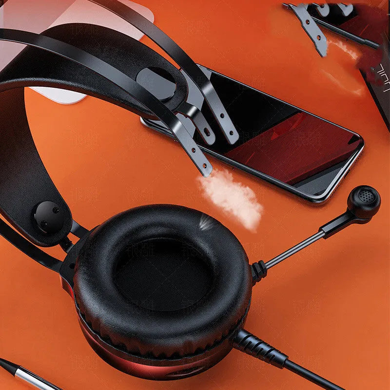Black wired PC headset with microphone, head-mounted design, and long cable on a white background