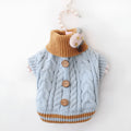 Classic knitted pet sweater in pink for small dogs, with twist button closure, on a white background