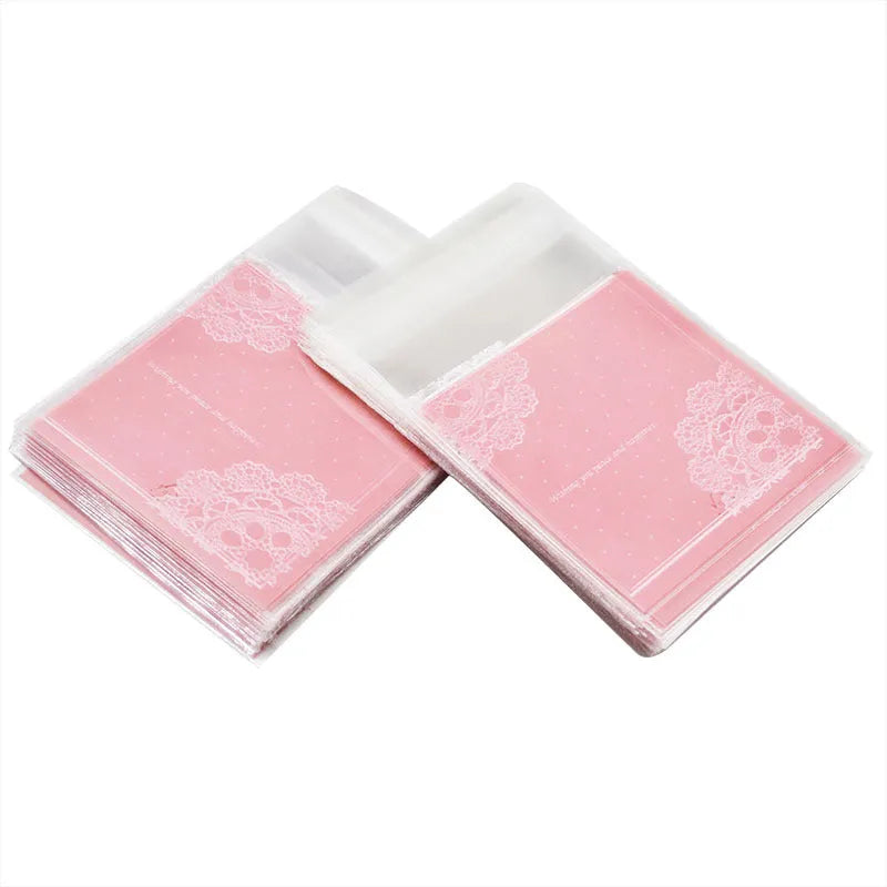 Pink self-adhesive plastic packaging bags with UV printing, shown sealed and open, next to a bar of soap.