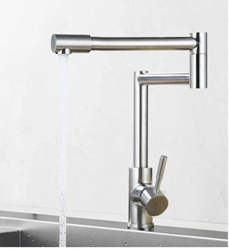 Silver stainless steel kitchen mixer tap with dual lever controls and rotating spout