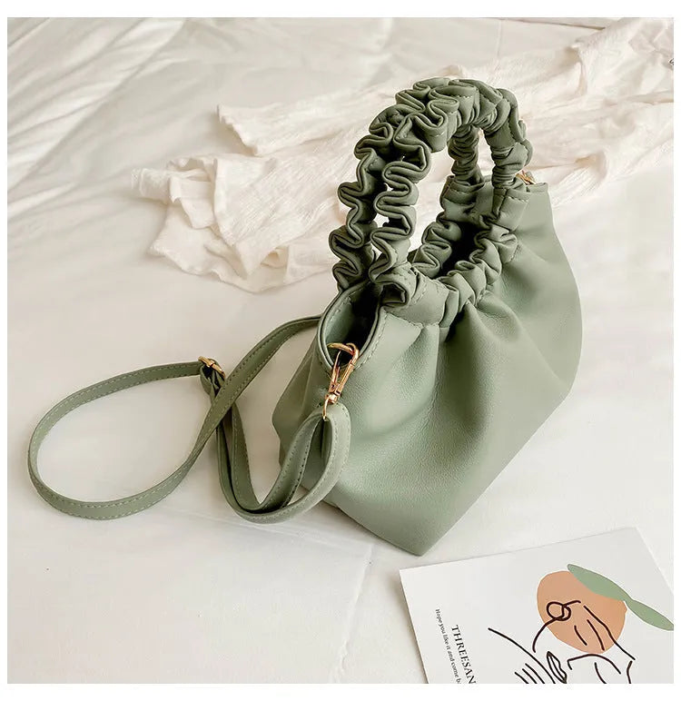 Medium one-shoulder bucket messenger bag in soft PU with fold detail and internal phone pocket