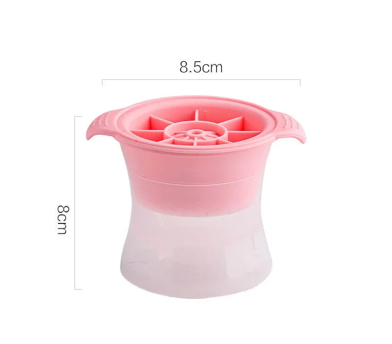 Flexible silicone ice tray showing large hockey puck and spherical ice cube moulds in pastel colours.