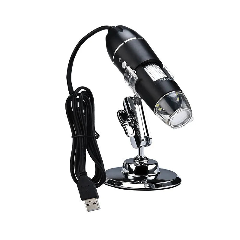 Black plastic portable 1000-times digital microscope with USB cable and 8 LED lights lying on a white surface