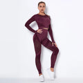 Women's long-sleeved seamless yoga wearsuit in a dark colour, shown in a yoga pose.