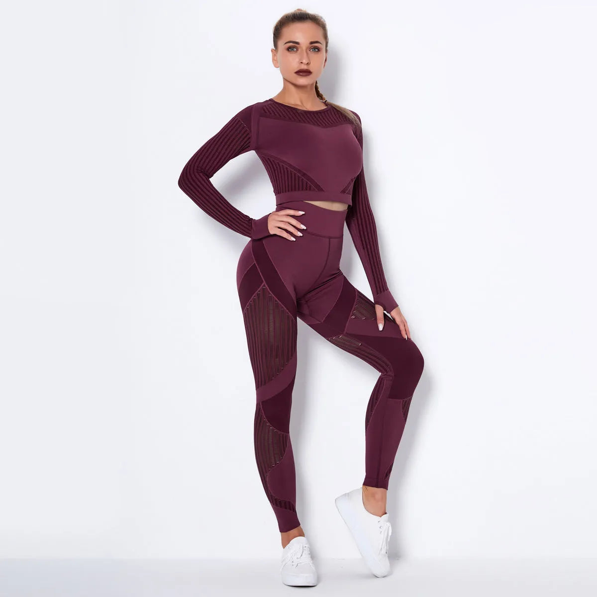 Women's long-sleeved seamless yoga wearsuit in a dark colour, shown in a yoga pose.
