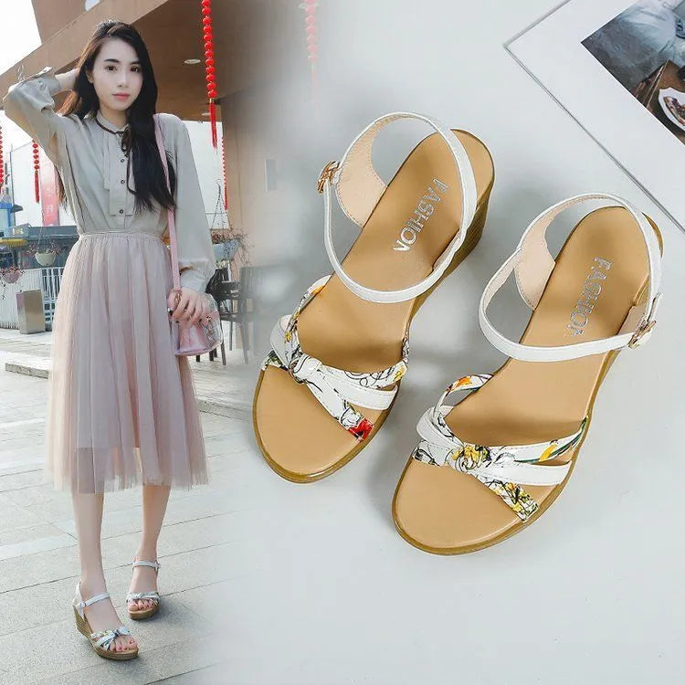 Women's pink wedge heel sandals with a buckle closure and textured non-slip sole on a white background.