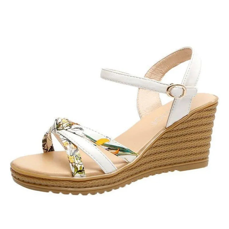 Women's pink wedge heel sandals with a buckle closure and textured non-slip sole on a white background.