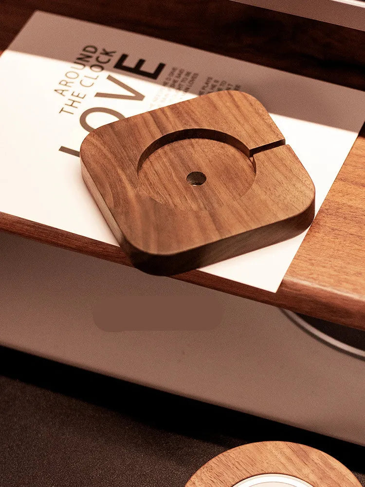Walnut wood MagSafe wireless charging bracket stand for iPhone on a desk