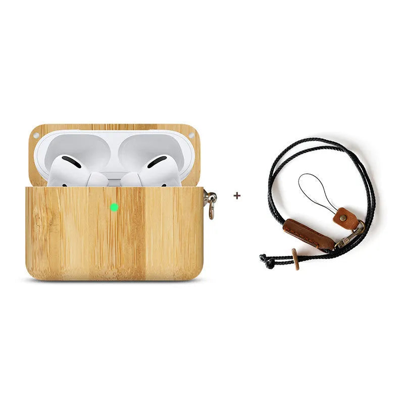 Solid walnut and bamboo wood sleeves for Bluetooth earphones on a wooden table.