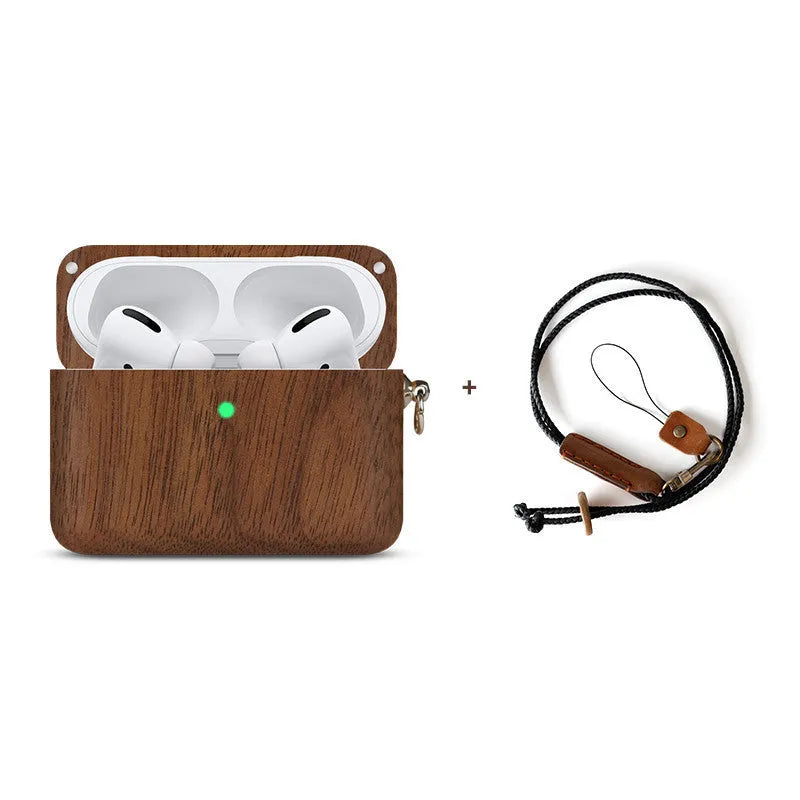 Solid walnut and bamboo wood sleeves for Bluetooth earphones on a wooden table.