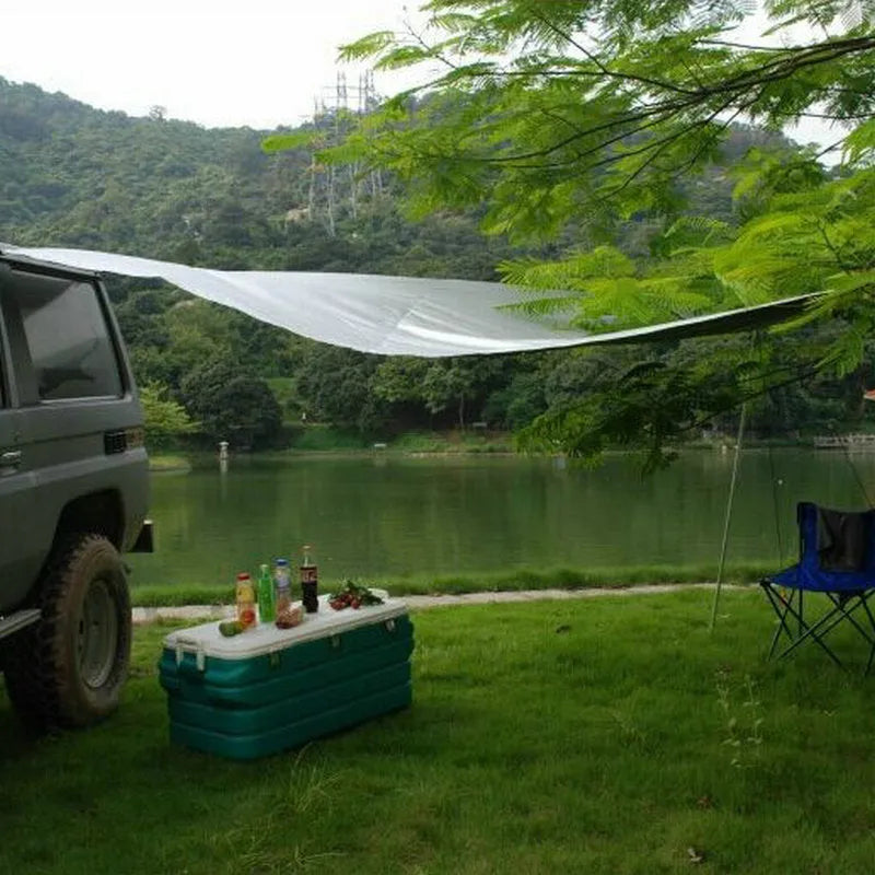 Green Unity car side awning set up next to a vehicle, showing the 2.8m x 1.8m double tent structure